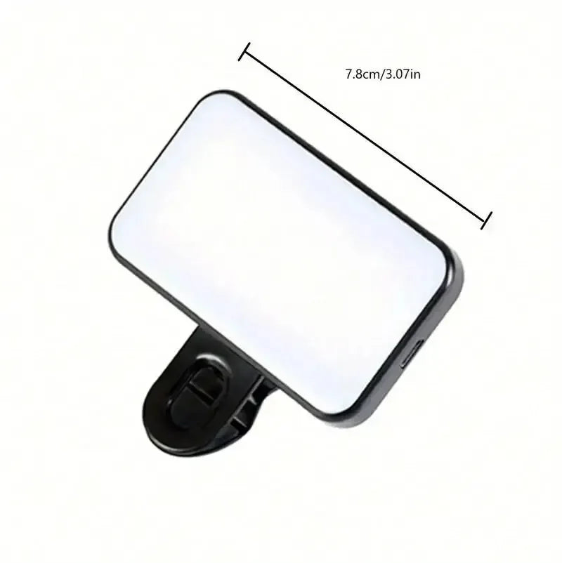 Black clip-on LED fill light with measuring dimensions on panel