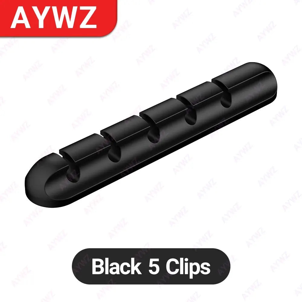 Black adhesive cable holder clip bar with five round openings for USB charging cords