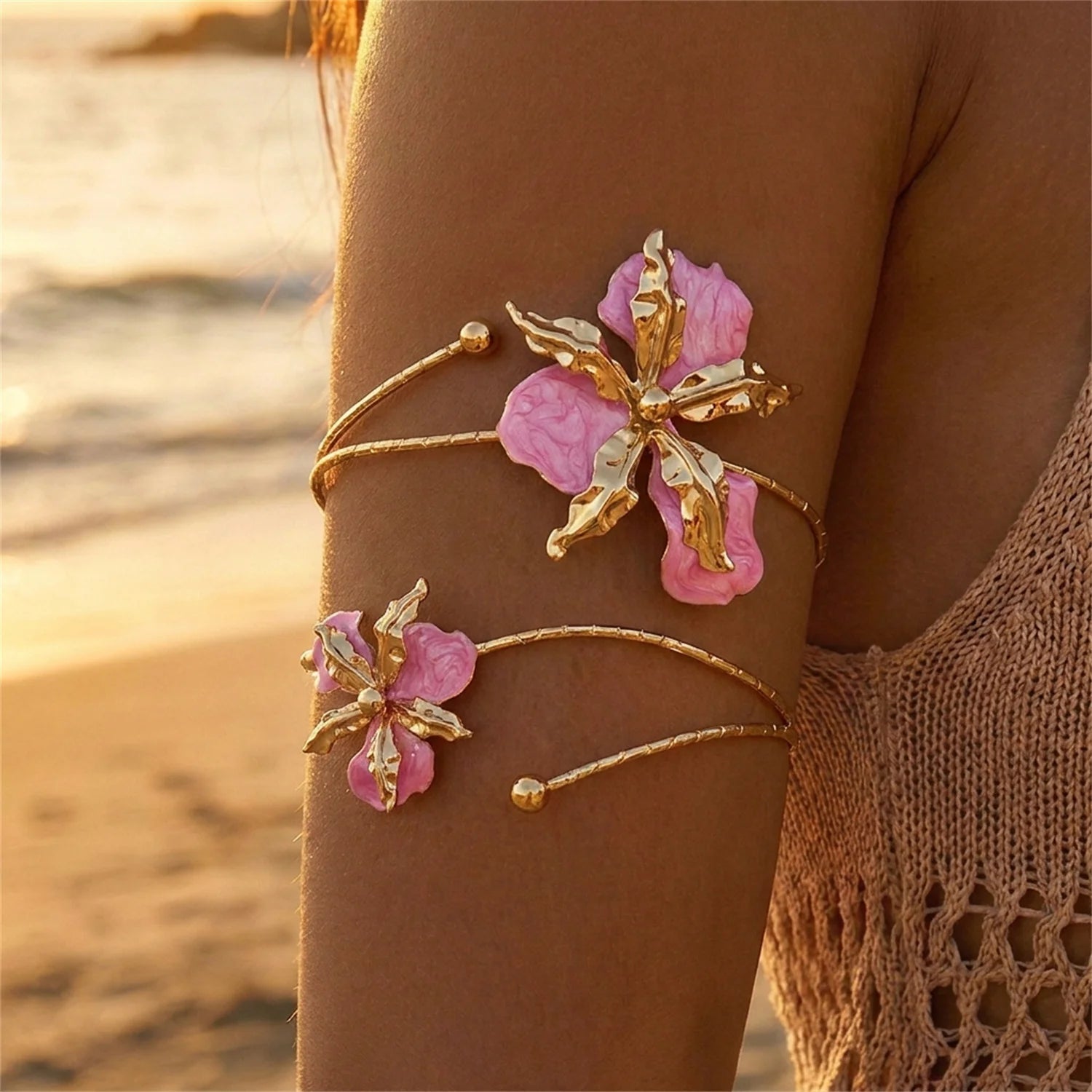 Gold open cuff arm bracelet with pink enamel flower cluster and adjustable chain links