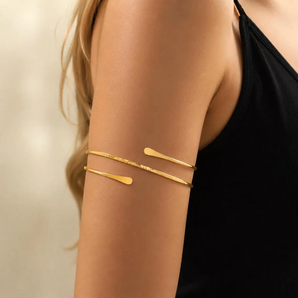 Gold-tone double-wrap open cuff bracelet with two slim bars on upper arm