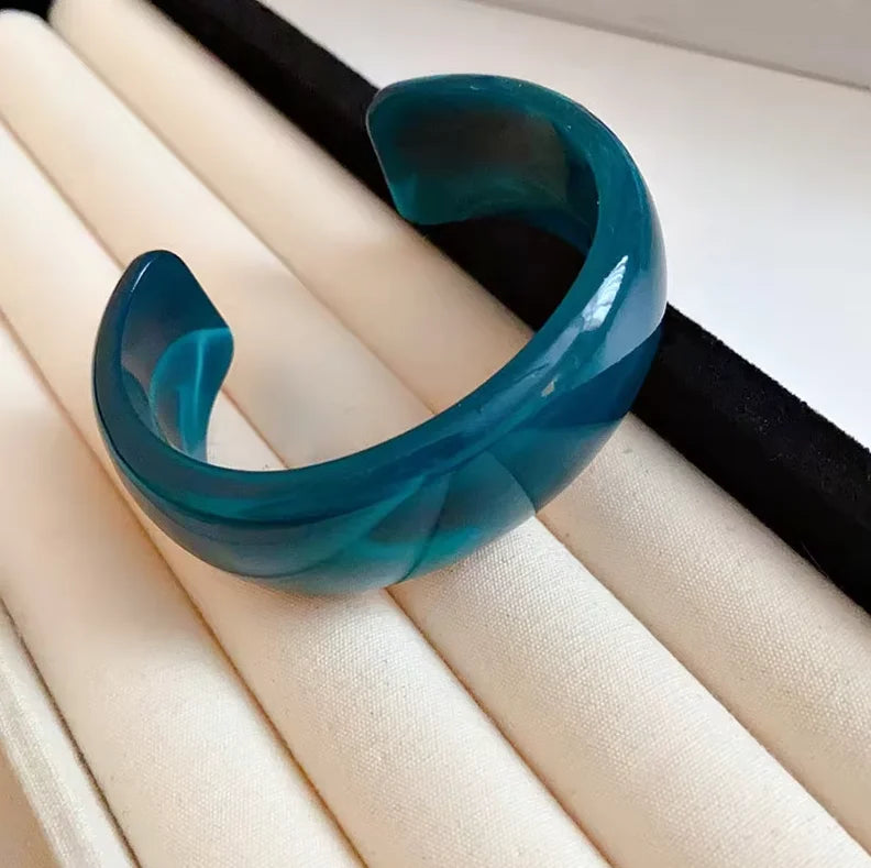 Teal glossy open acrylic bangle with smooth curved wide open cuff design