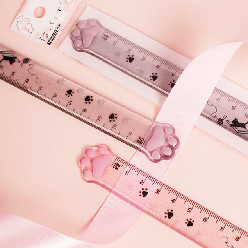 Pink cat paw plastic straight ruler with paw-shaped end and measurement markings