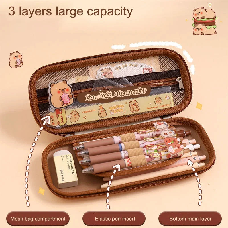 Pink capybara pencil case open, showing mesh pocket and elastic pen insert.