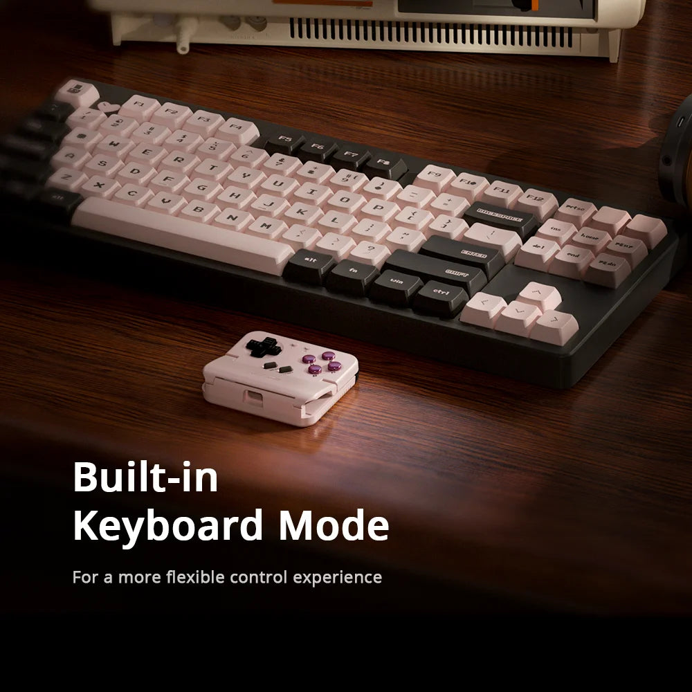 Portable handheld gaming controller with keyboard-style key array and purple buttons