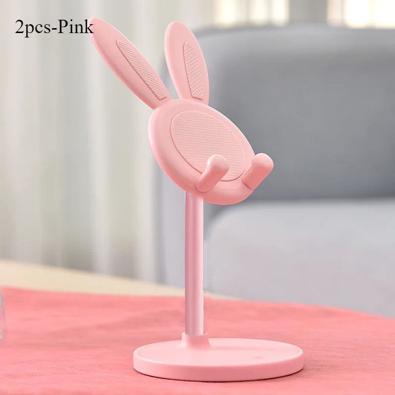 Pink rabbit phone stand with tall post and round mesh top on a flat base