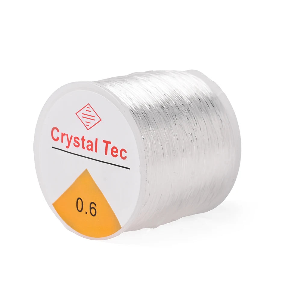 White elastic cord spool labeled 0.6mm, Crystal Tec