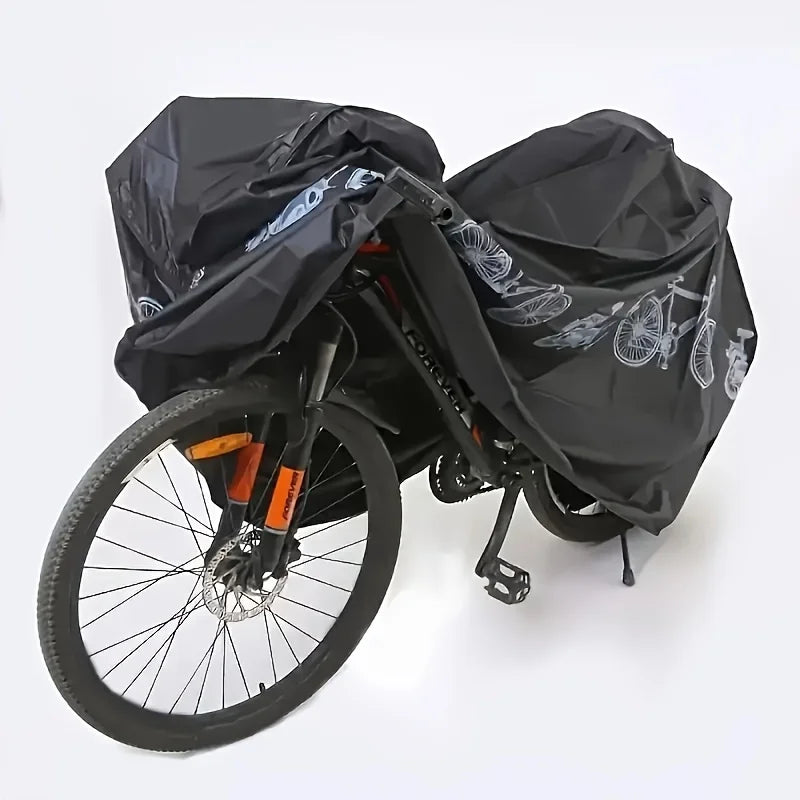 Black waterproof bike cover with bicycle print, covering a bicycle with front wheel visible