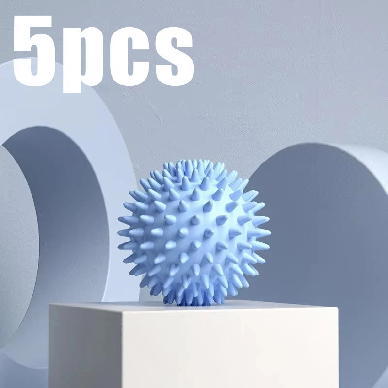 Blue spiky fascia massage ball for muscle relaxation, shown on a block pedestal