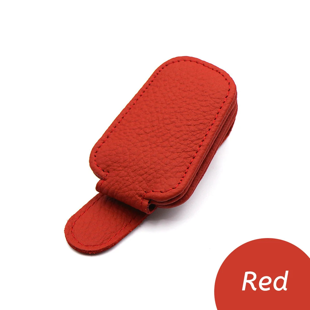 Red car glasses clip holder with stitched leather-look finish and curved strap.