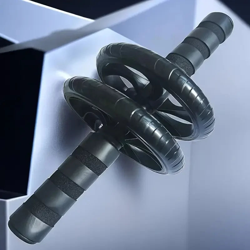 Black dual-wheel abdominal roller with two wheels and ribbed foam grip handles