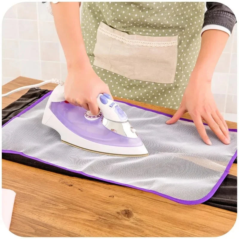 Protective ironing mat cover, light gray mesh with purple edge border and iron