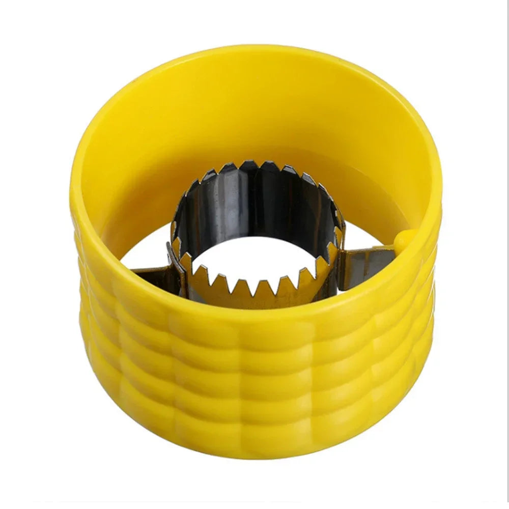Yellow corn cob stripper peeler with serrated wheel blade, close-up on white background.
