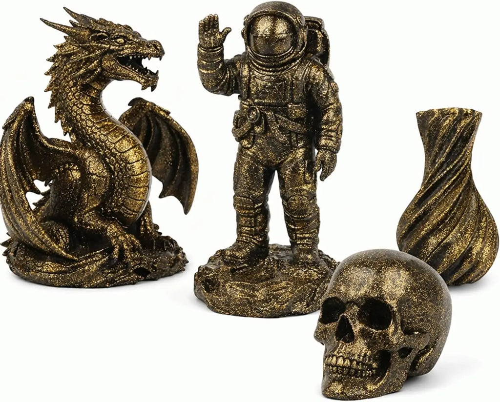 Gold glitter 3D printed figurines: dragon, astronaut, vase, and skull
