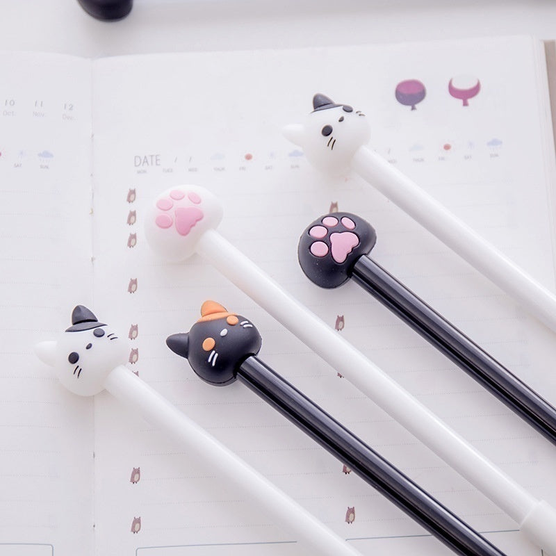 Kawaii cat gel pen set (10-pack) spread on paper: white and black pens with paw heads